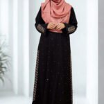 "Stylish, loose-fitting borkha made of BMW fabric with stone work and side embroidery for ladies of all ages."