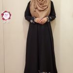 Image of a woman wearing black gown