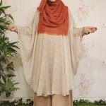 image of a woman wearing cape