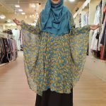 image of a woman wearing cape