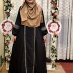 One part borkha with heavy embroidery work on arms and front made of BMW material.