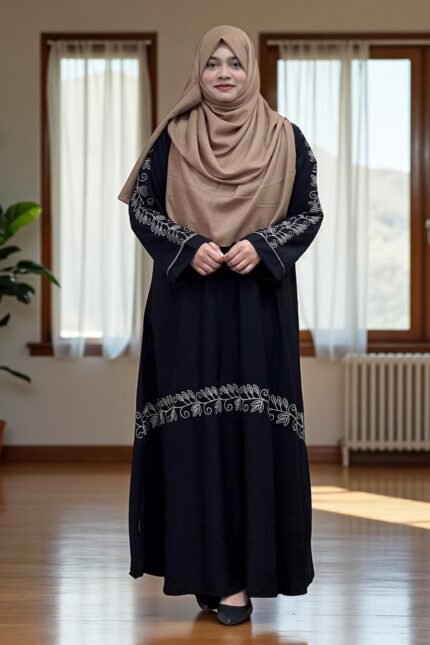 This borkha has a sleek flat one-cut design with detailed embroidery. It is finished with stylish buttons on the sleeves, giving it a unique and elegant touch.