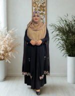 Women’s black cape in free size with elegant embroidery design.