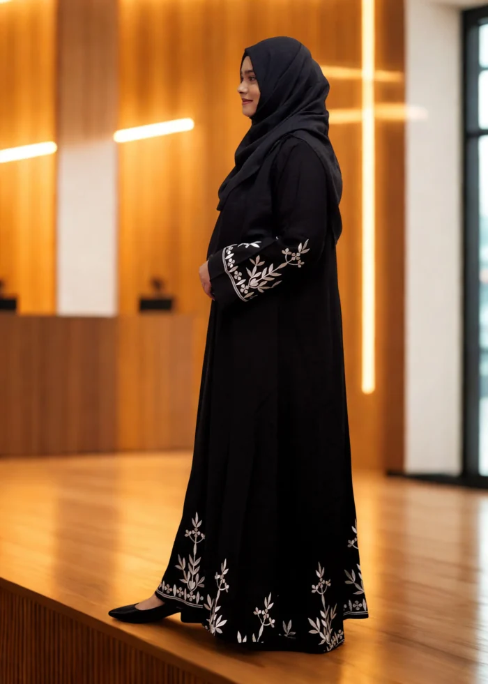 Elegant black borkha with white embroidery design made from soft BMW fabric