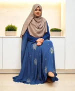 An elegant transparsent georgette pocket cape detailed with frills and intricate work was donned over a shirt.