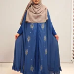 An elegant transparsent georgette pocket cape detailed with frills and intricate work was donned over a shirt.