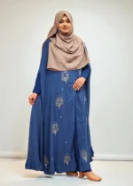 An elegant transparsent georgette pocket cape detailed with frills and intricate work was donned over a shirt.