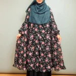 This new fusion cape is elegantly designed for women, made from soft transparent georgette material, with a front-open khimar-shaped design and frilled hem. This cape is made perfect for layering with kameez, inner, or saree.
